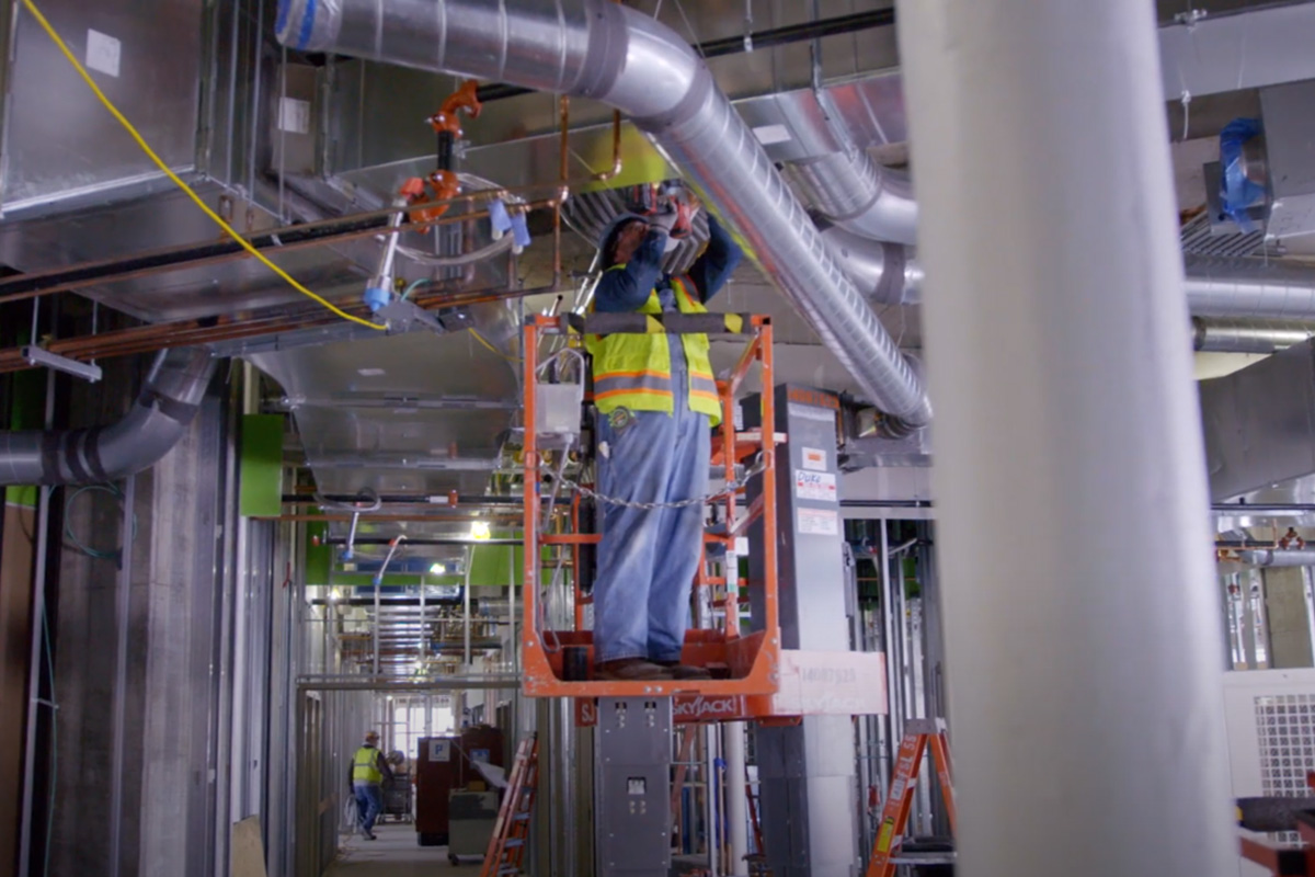 hvac technician installing hvac system