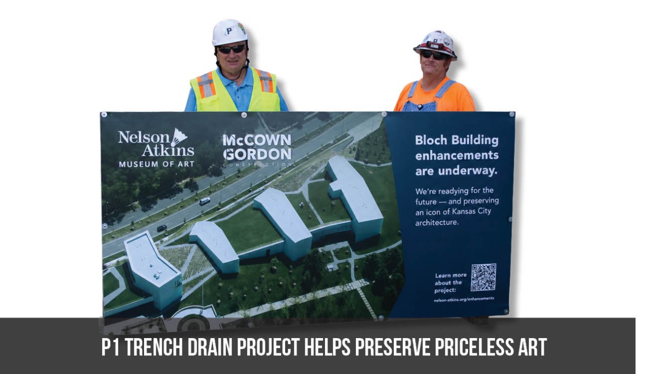 P1 project manager Jack Kobe and Plumbing Foreman Clay Anderson in front of a Nelson-Atkins Museum of Art sign describing enhancements underway