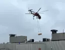 helicopter delivering construction materials