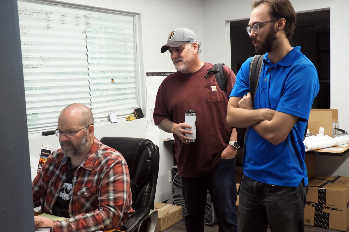 construction experts reviewing project plans
