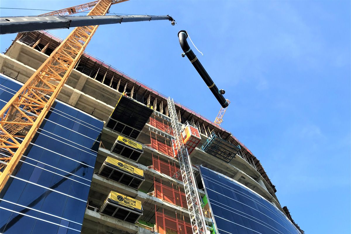 aquatherm piping being installed via crane