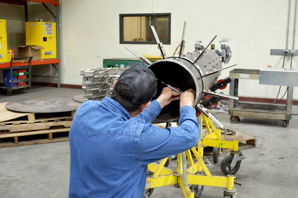 fabrication millwright working on custom fabrication job