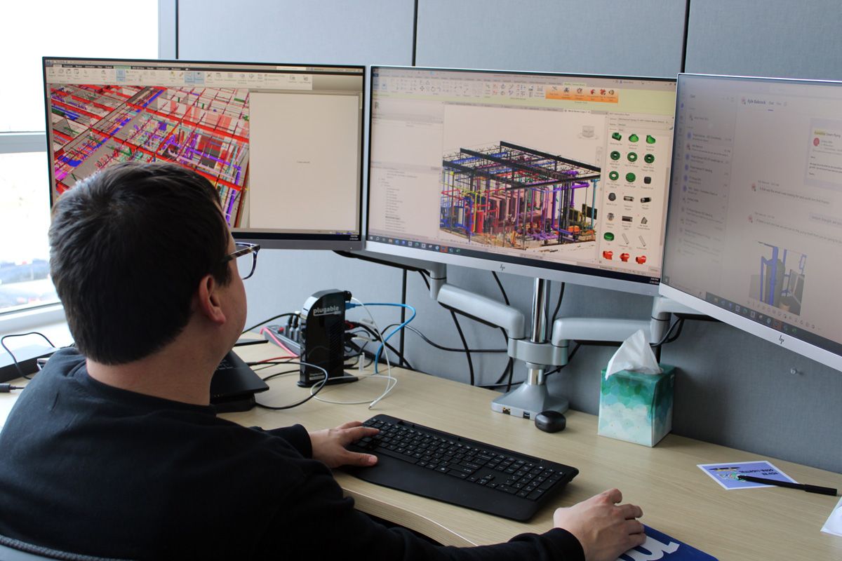 bim and vdc technician working at computer