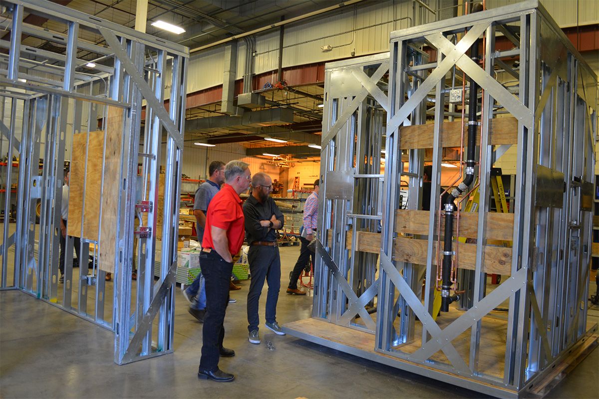 clients examining modular fabrication project